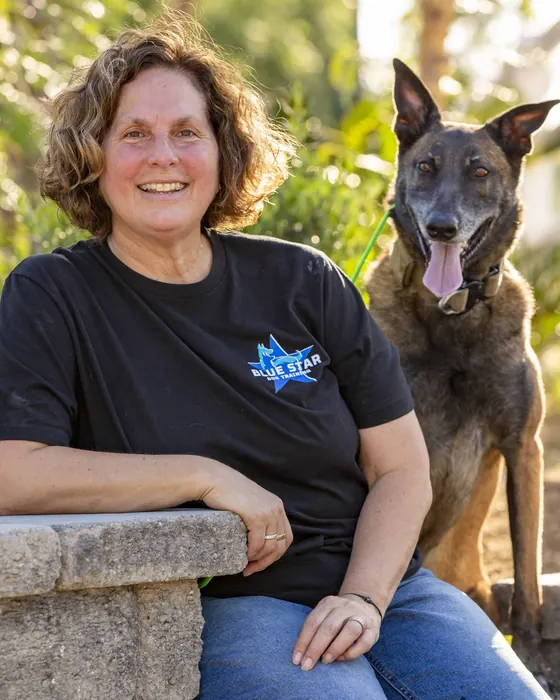Elke Barbao, Owner, Trainer at Blue Star Dog Training, with a dog at the ranch